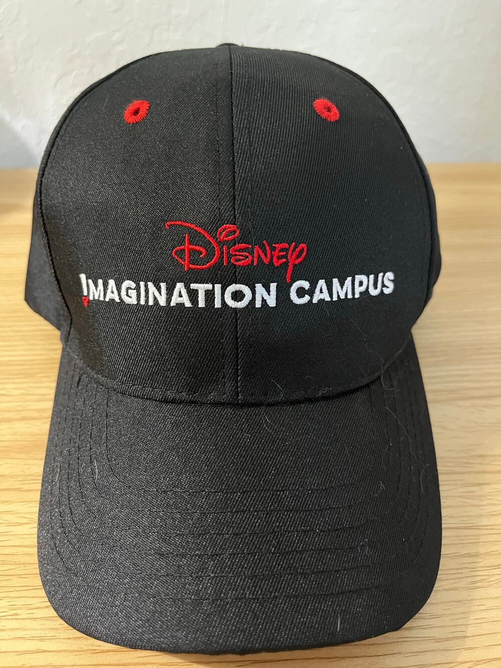 Disney Parks Imagination Campus logo Black Baseball cap red white embroidered